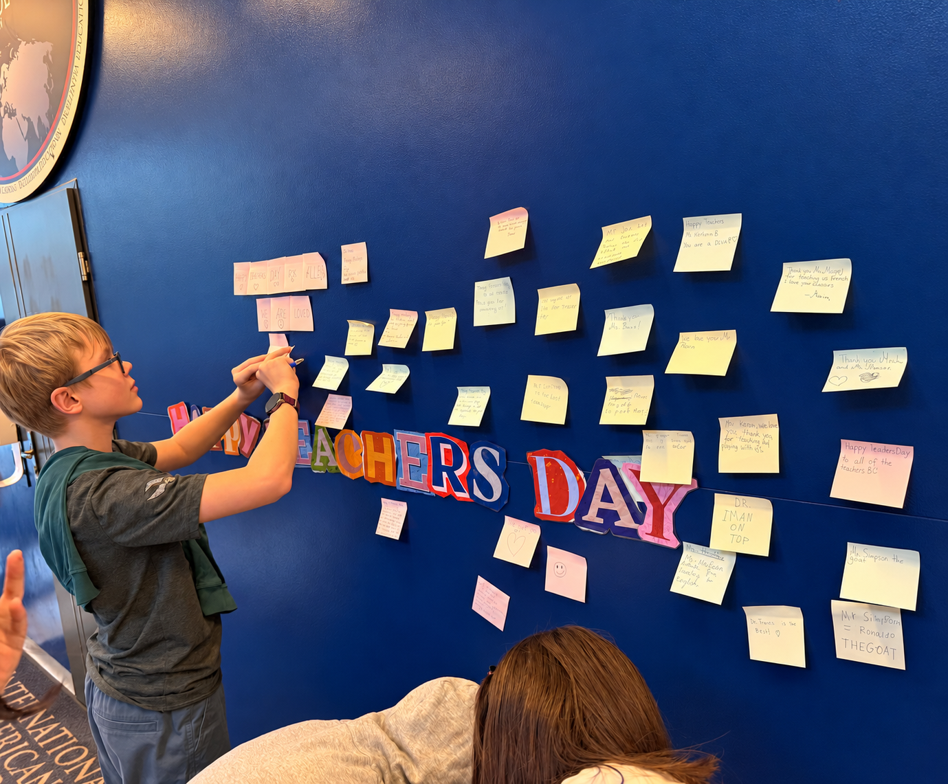 A student adds a Teachers’ Day message