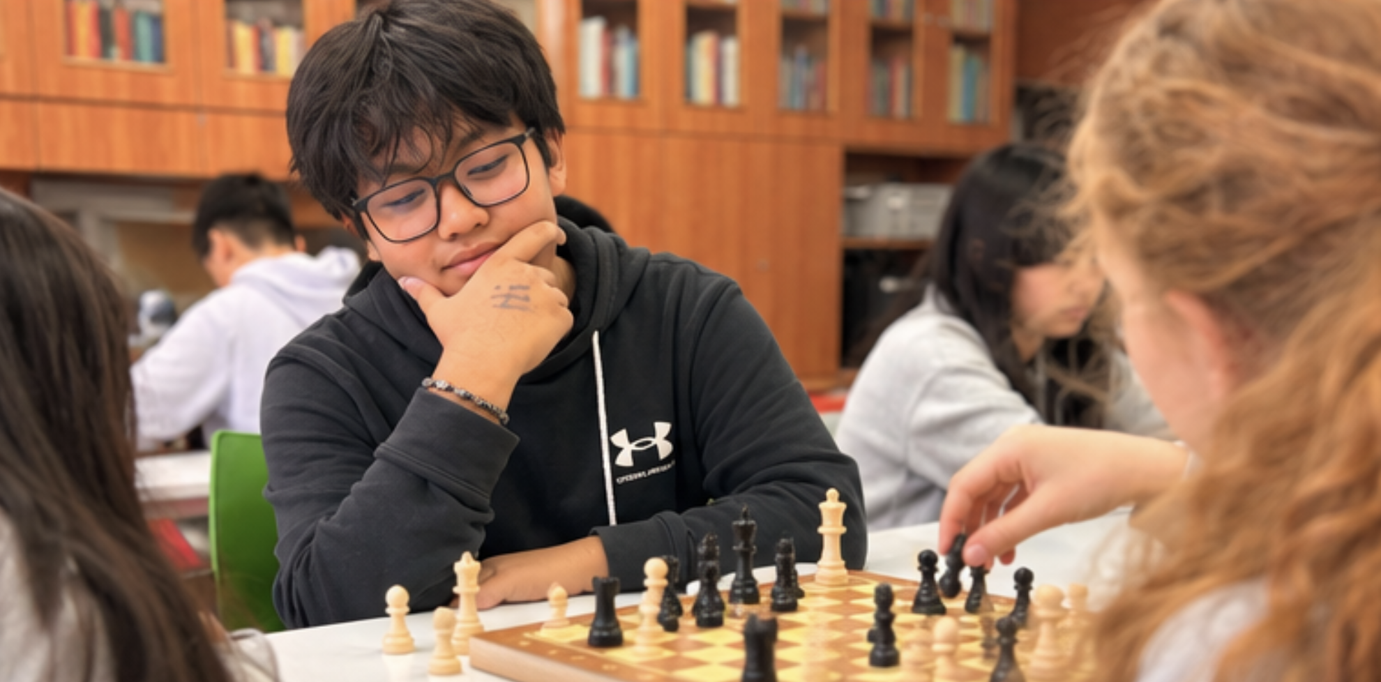 Students playing chess at Games Club