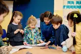 Kindergarten children working together at a table at IAS Warsaw