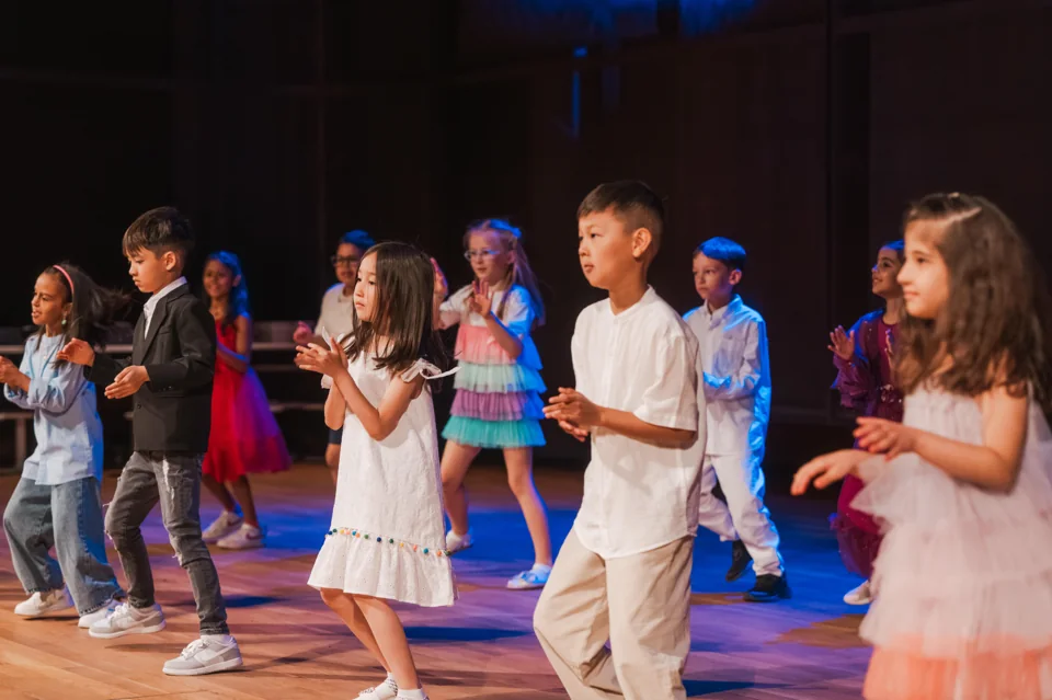 IAS children performing together on stage