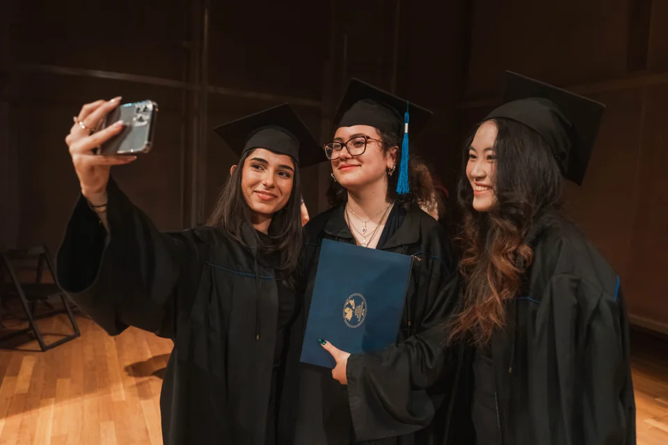 IAS graduates taking a photograph together