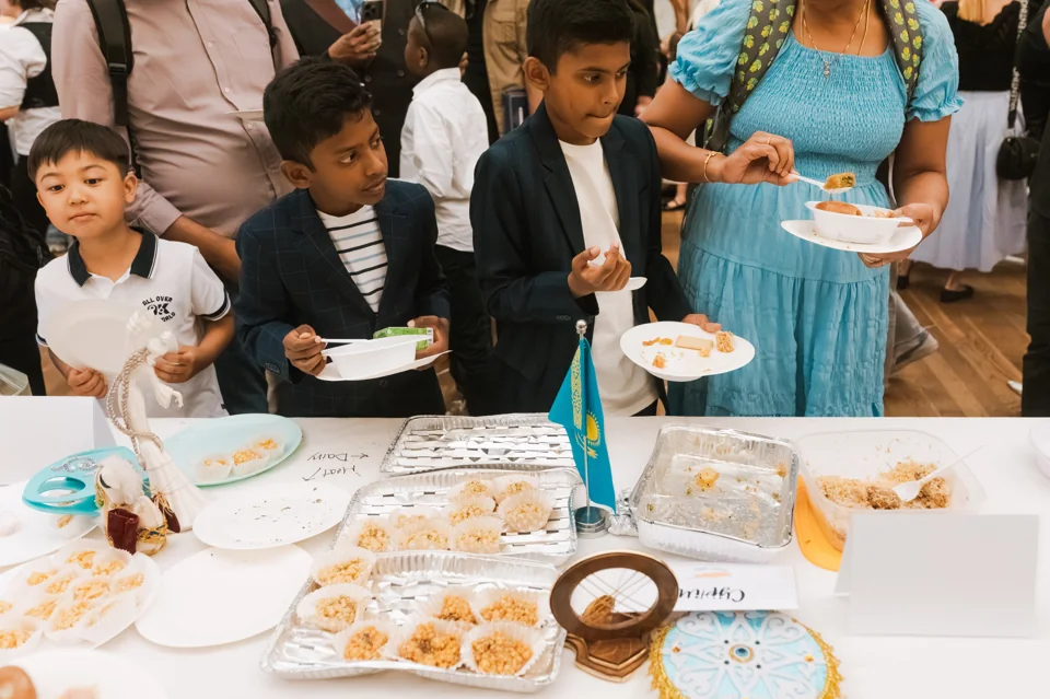 IAS students and families sharing food at a school event